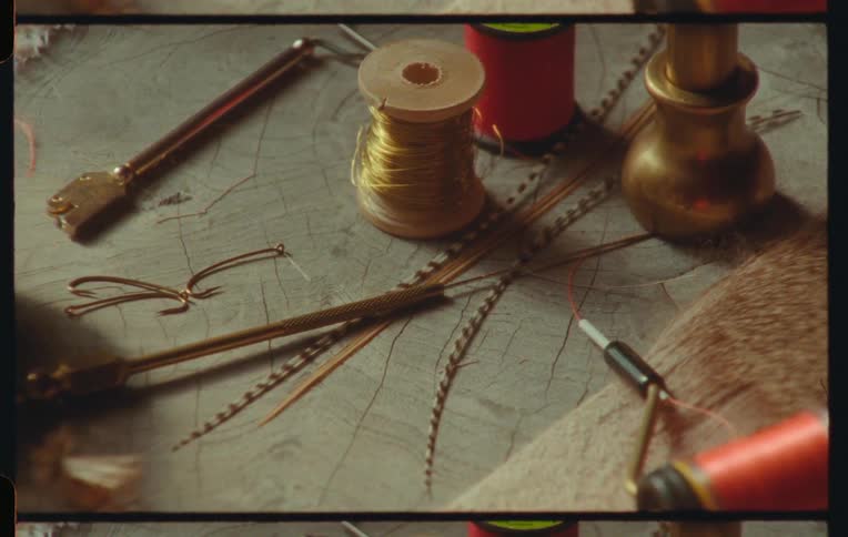 Hand working with sewing tools