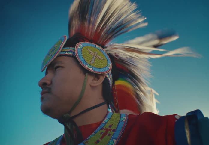 Side portrait of a native american man in traditional dress