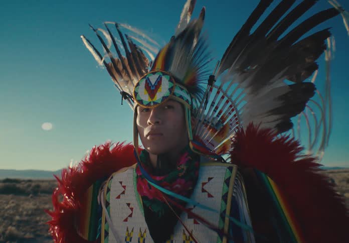 A clip of a native american tribesman in traditional costume