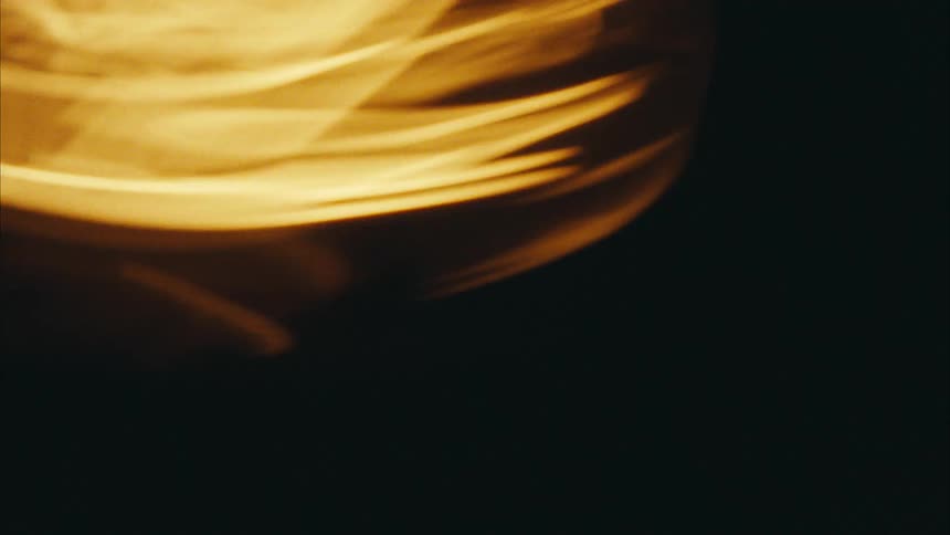 Abstract light reflection in motion against a dark background