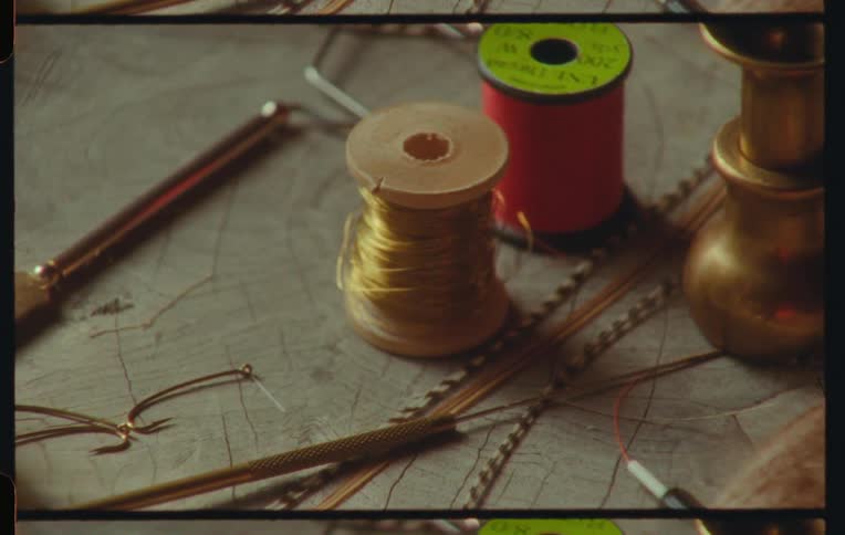 Sewing accessories including thread and scissors on a table