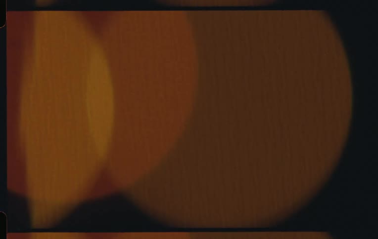 Some yellow circles passing to the right and are on a black background