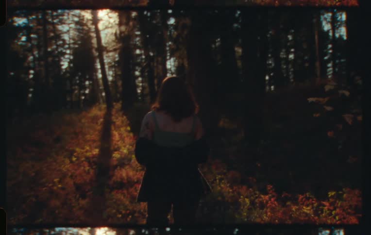 A clip of a lady walking in the bush