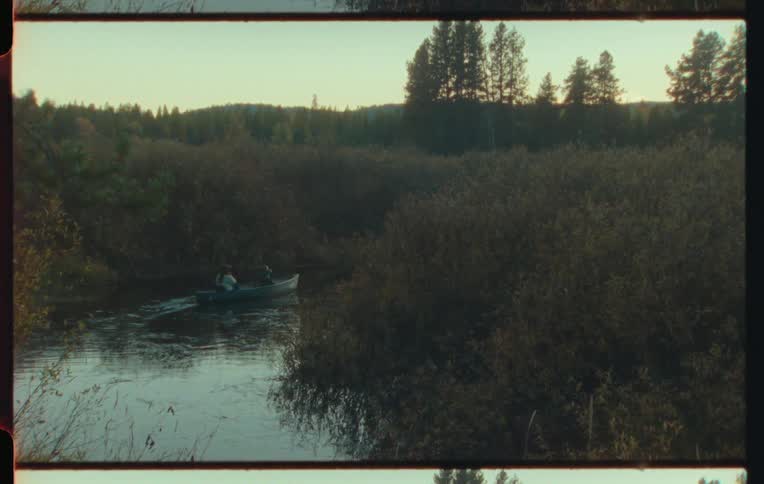 A clip of a canoe on the river