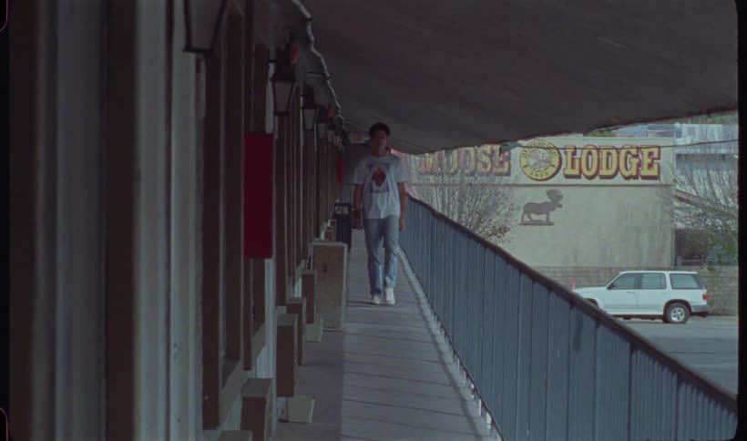 Man walking in the hallway of an urban building