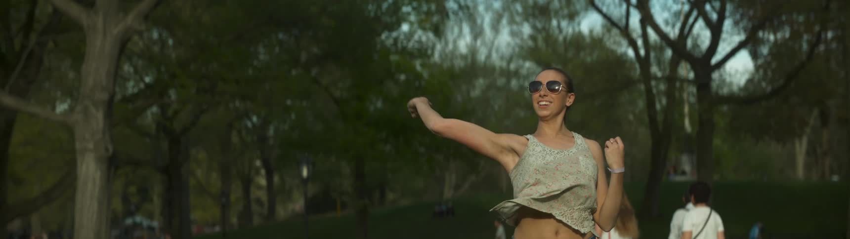 A woman throws a tennis ball