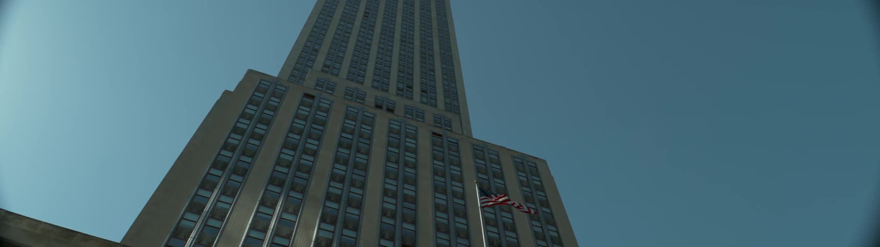View of a large building with a flag in front of it