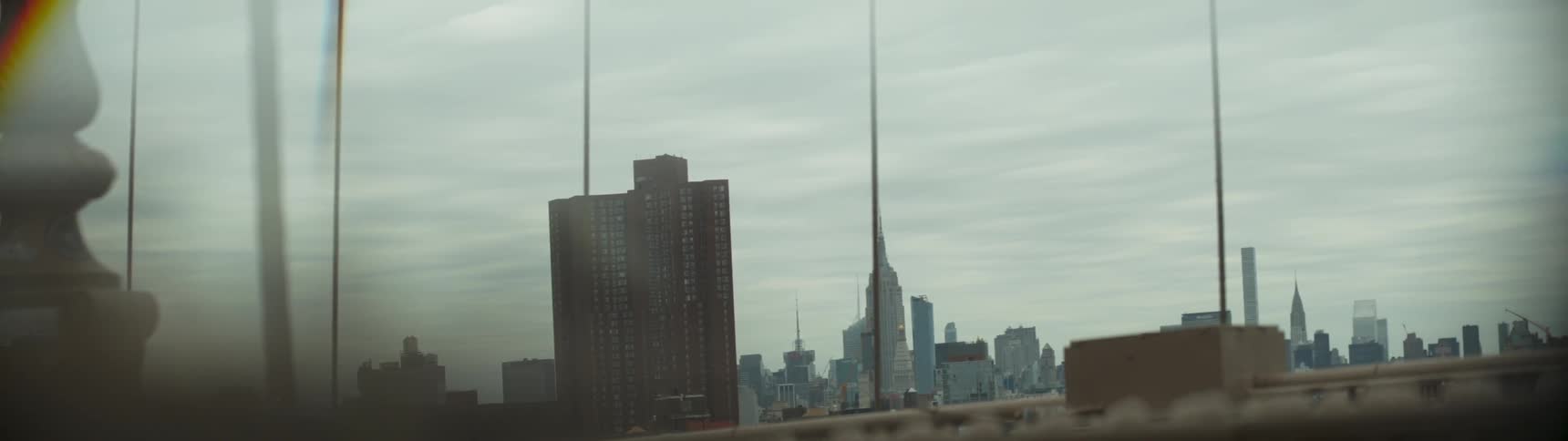 A large apartment building towers over the city
