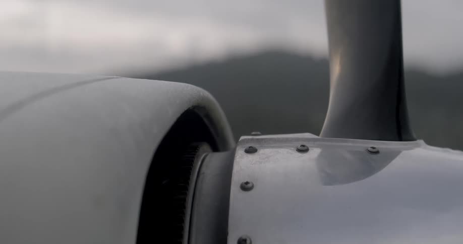 Side view of a propeller and turbine of a metal airplane