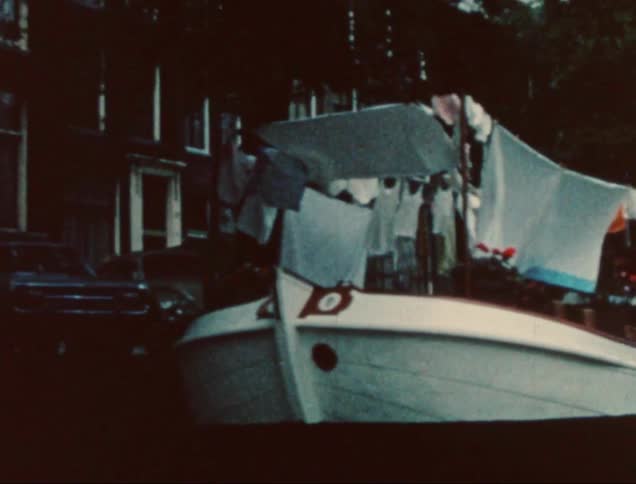 A clip of a boat beside a building