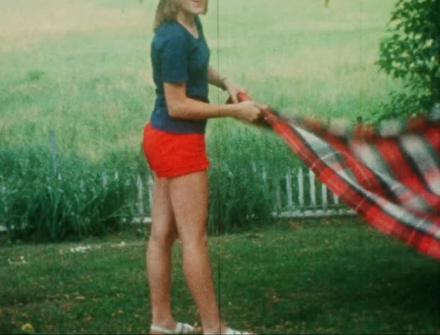 A clip of a lady having fun at the lawn side