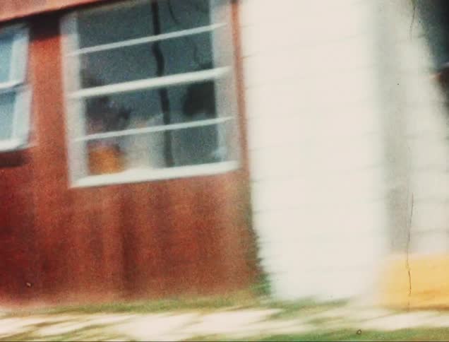 A motion clip of houses along the woodlands