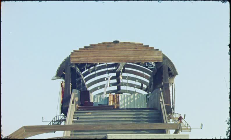 White dress hanging on a hut at the top