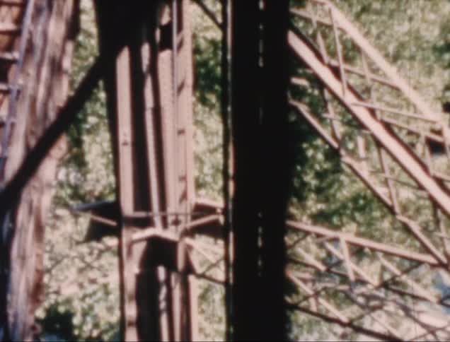 Historic structure towers over nearby trees during the day