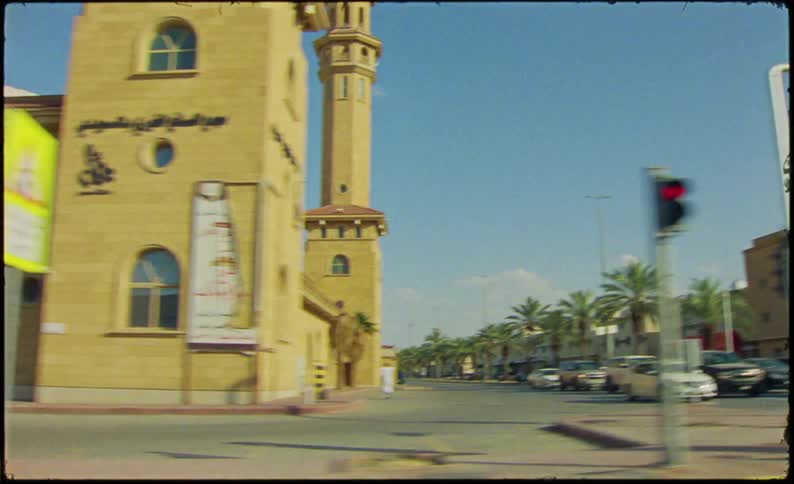 Busy intersections near a gas station and a church