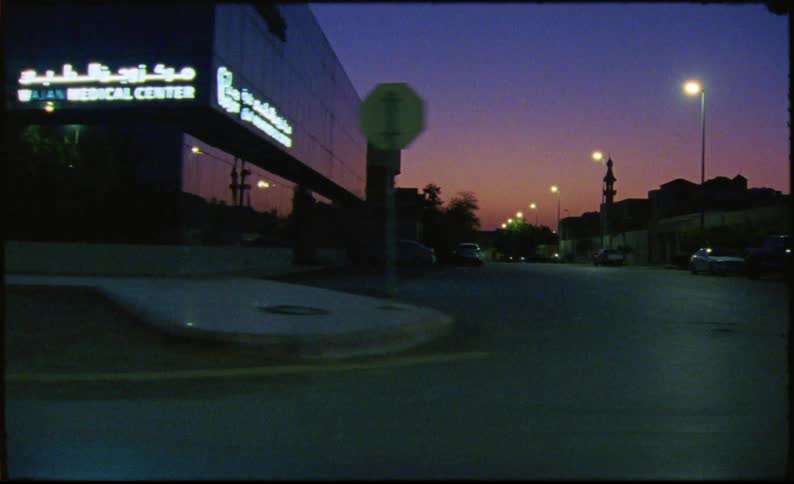 Streets and intersections of a city illuminated at night