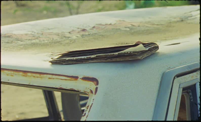 A clip of a book on a car roof
