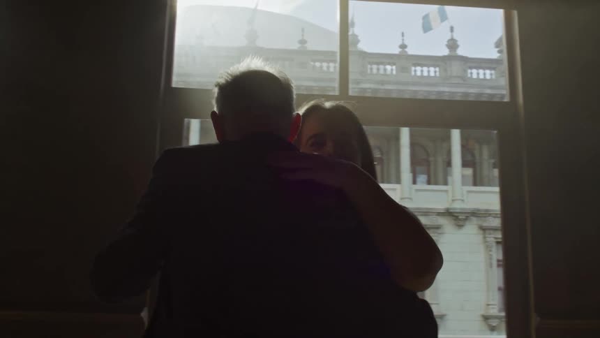 Couple dancing together in an interior space of a building