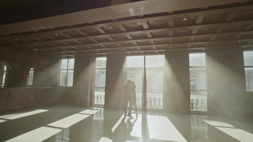 Man and woman in an indoor hall dancing together isolated