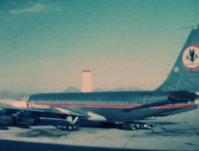 A parked commercial airplane is situated on an airport tarmac