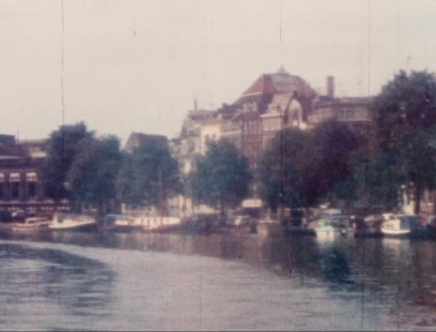 Maritime canal with boats and old buildings in the background