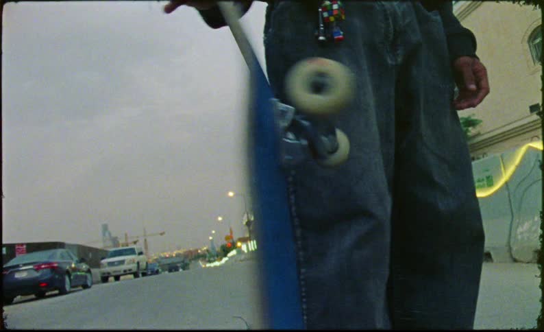 Hand of a person spinning a skateboard