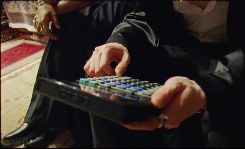 Person sitting interacting with a calculator