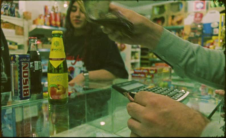 Teenagers buy drinks in the store