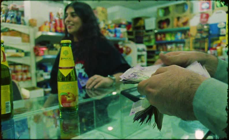 A clip of people making a purchase at the store