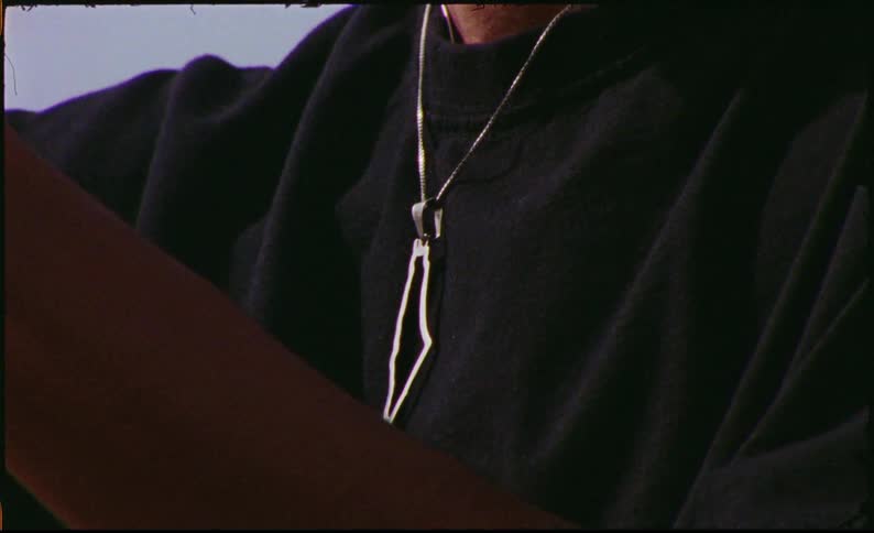 Close up of a shiny necklace on a person