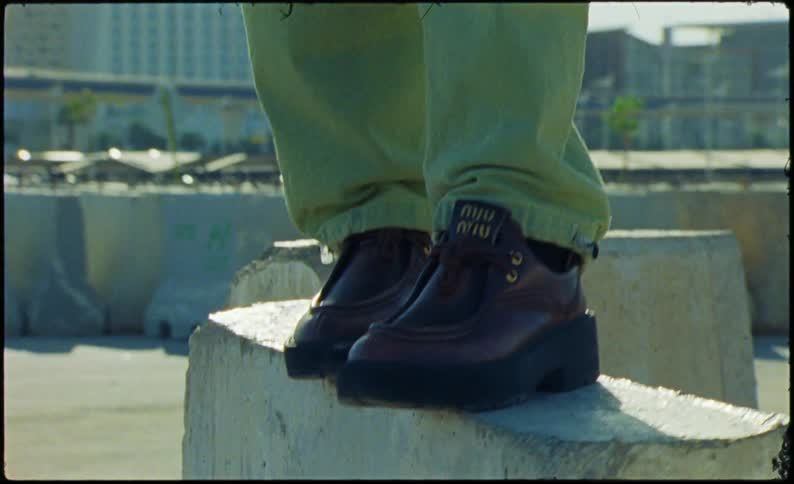 A person is standing on a slab of concrete