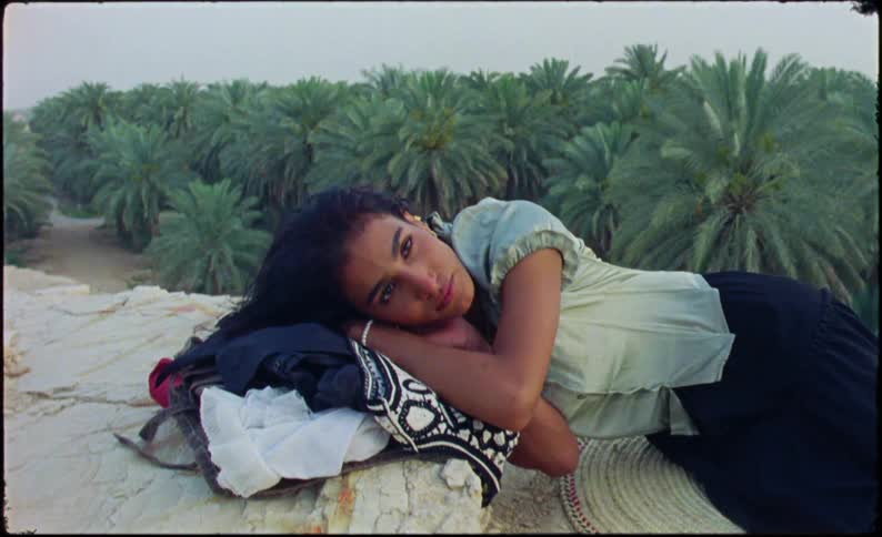 Woman lying in clothes with a background of a tropical forest
