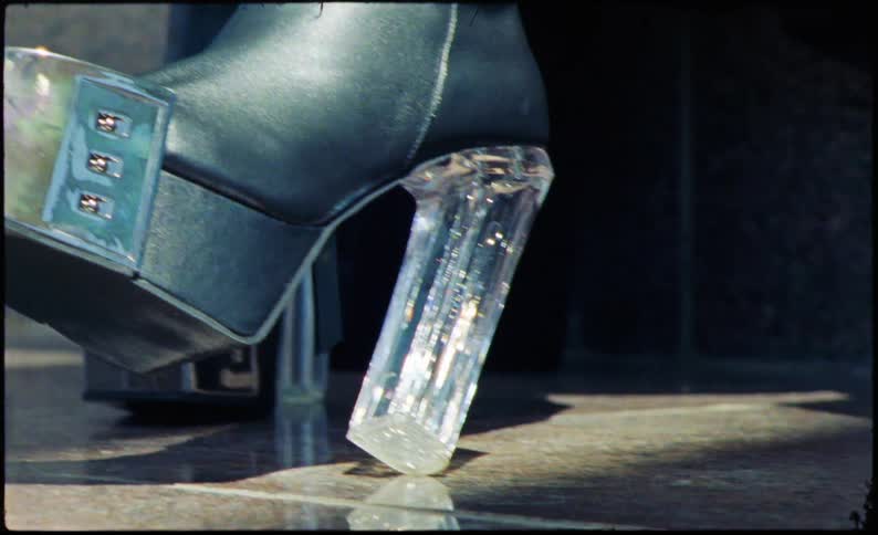 Close up of leather high heel boot