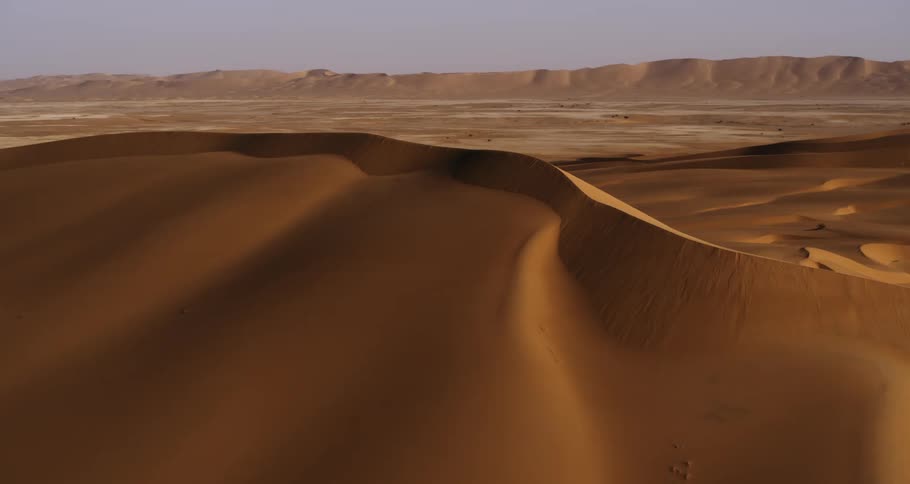 Aerial panorama of beautiful golden dunes in the desert in Saudi Arabia