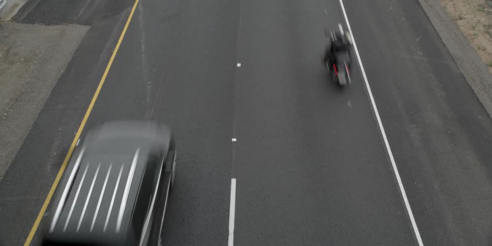Motorcycles and cars on a highway