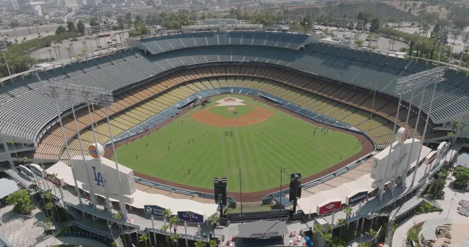 An aerial view captures the iconic dodger stadium in los angeles its vast seating bowl empty