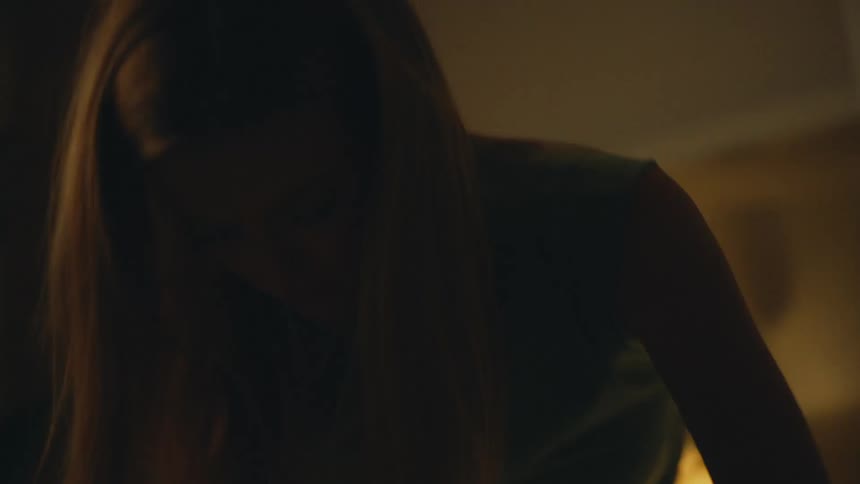 Woman packing her bags on the bed and crying