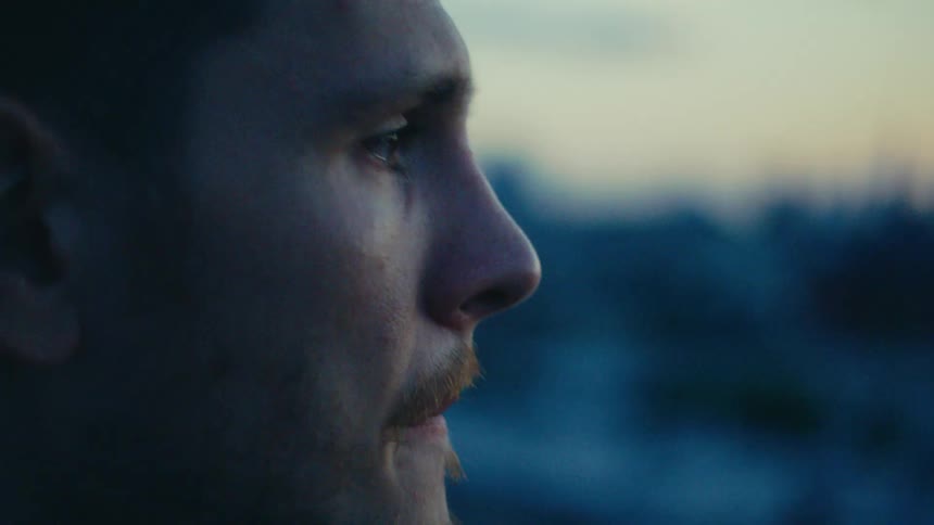 Side portrait of a pensive man