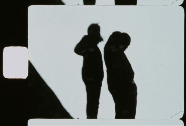 Silhouette of a man and a woman on a mountain