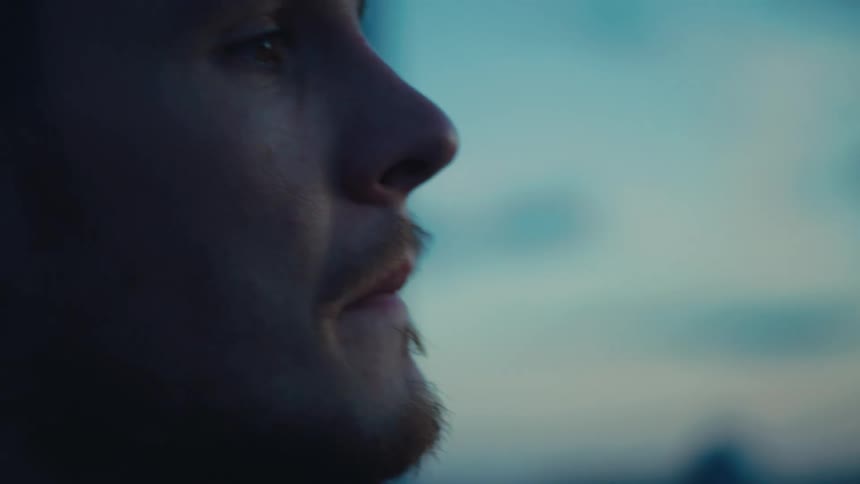 Side portrait of a man in an outdoor area