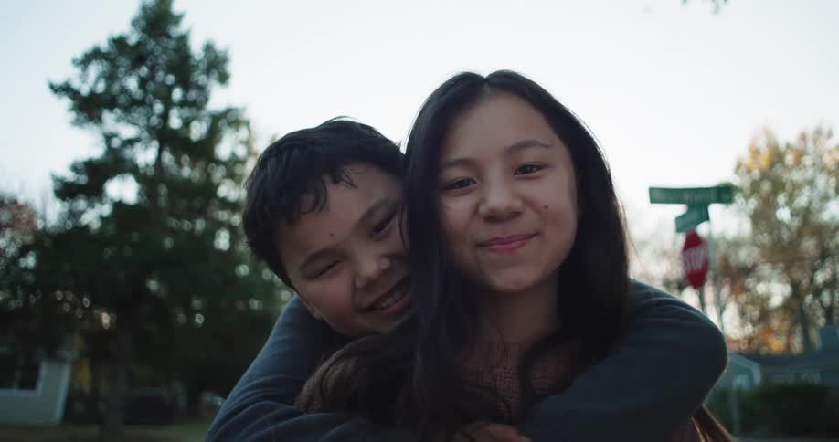 Portrait of two brothers hugging happily
