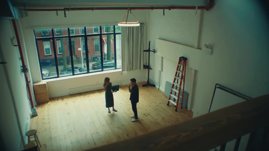 Female real estate agent presenting a property to a man