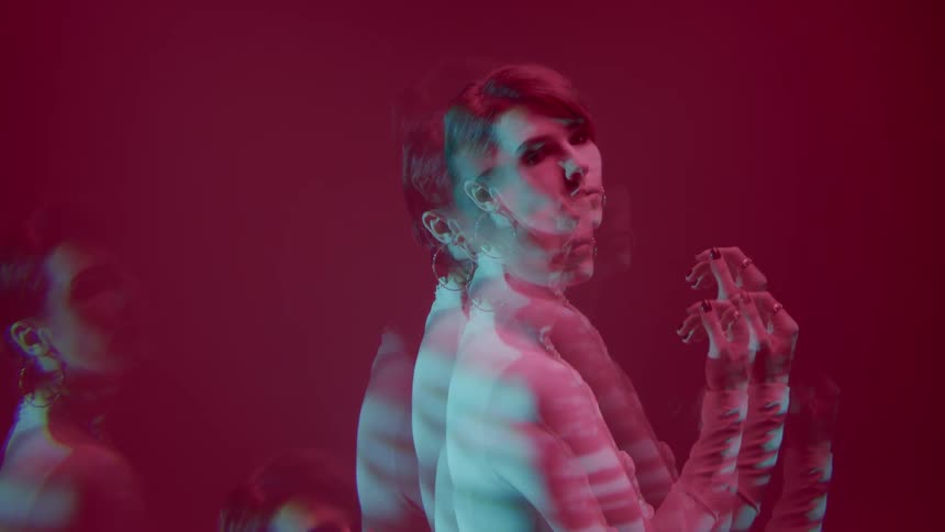 Multiple exposures of a female model against a pink background