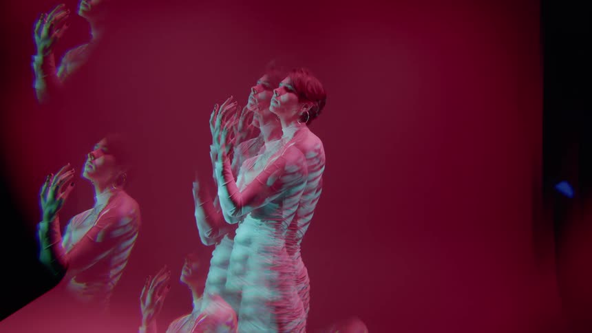 Multiple exposures of a woman wearing a white outfit in an indoor space