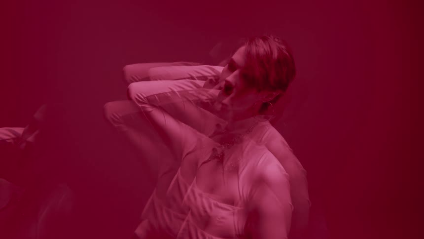 A woman is looking around in the dark