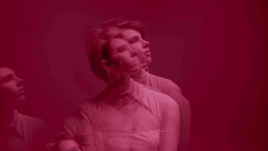 A woman is looking around behind the haze