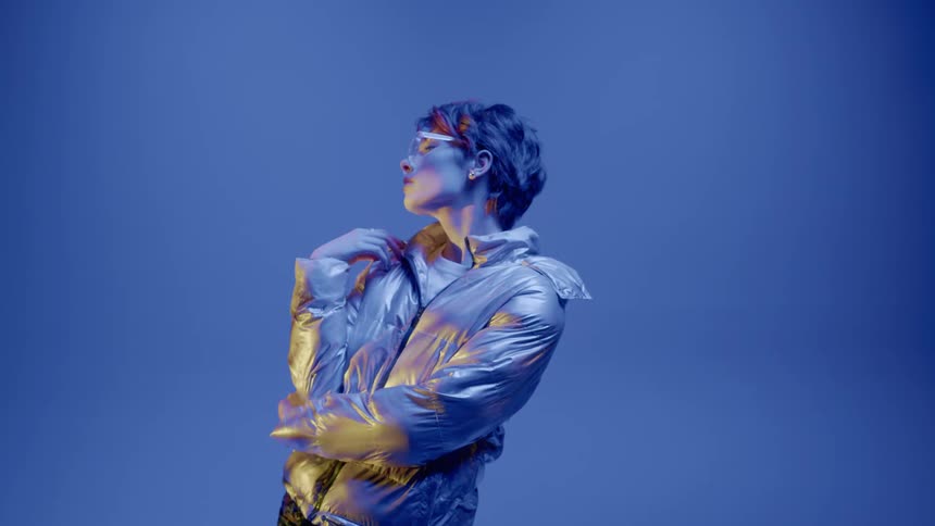 A close up clip of a female model posing and dancing