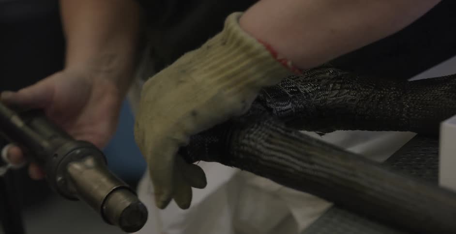 A worker using a heat gun