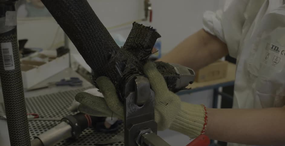A factory employee works on assembly