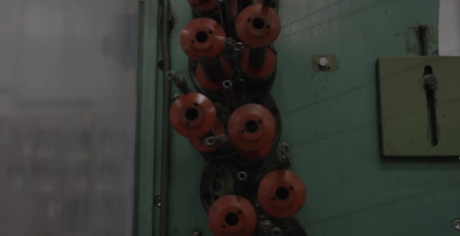 A machine is pulling thread